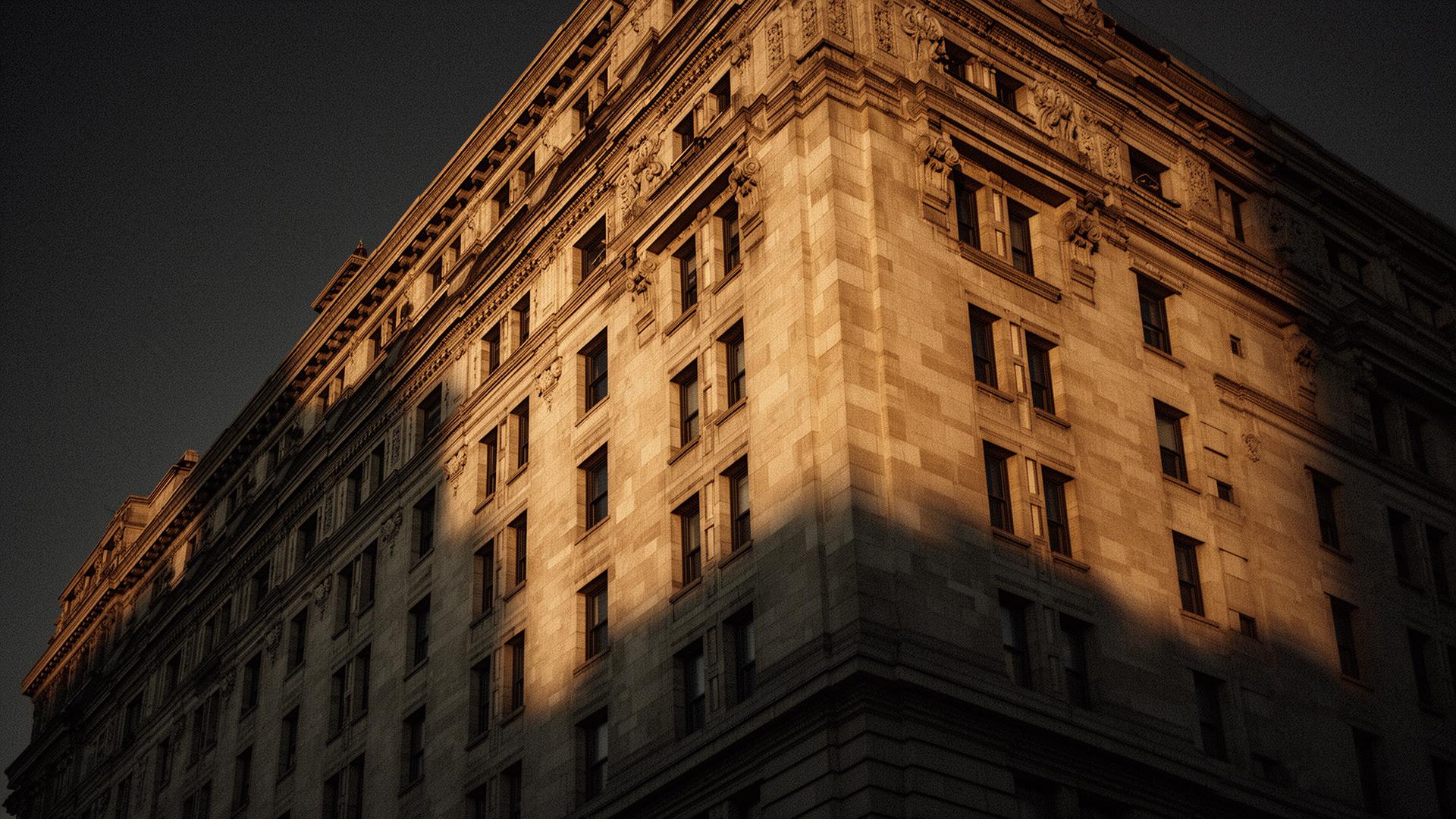 Historic stone facade illuminated at golden hour